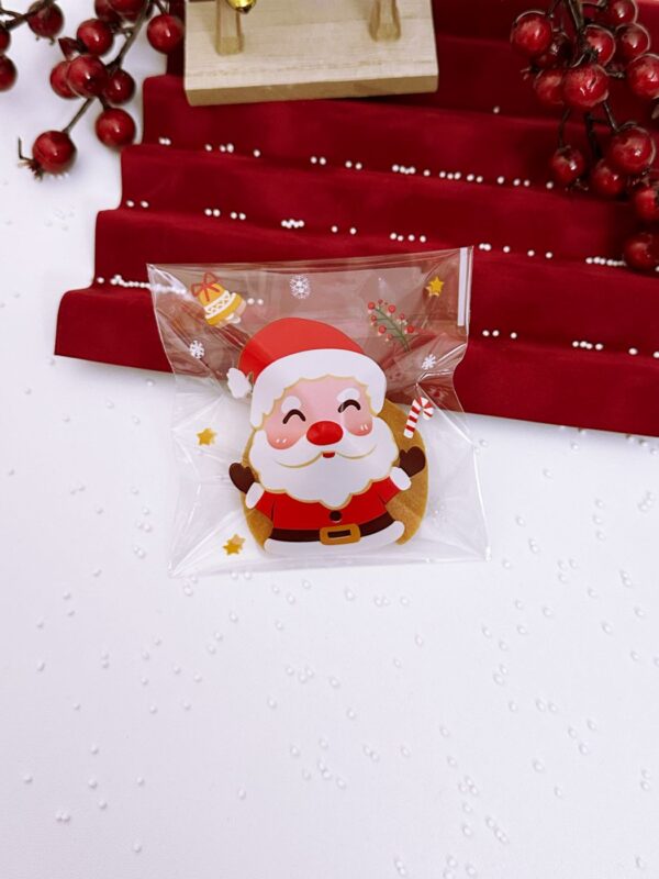 Laimės sausainis supakuotas Kalėdiniame maišelyje